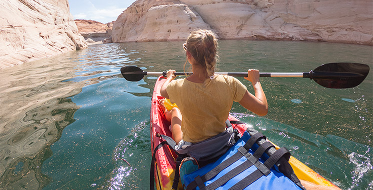 Woman paddling on Sandstone Canyon, Arizona