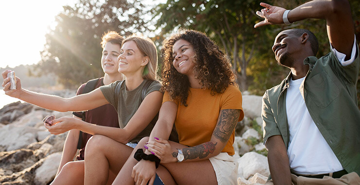 Group of friends taking a selfie while outdoors