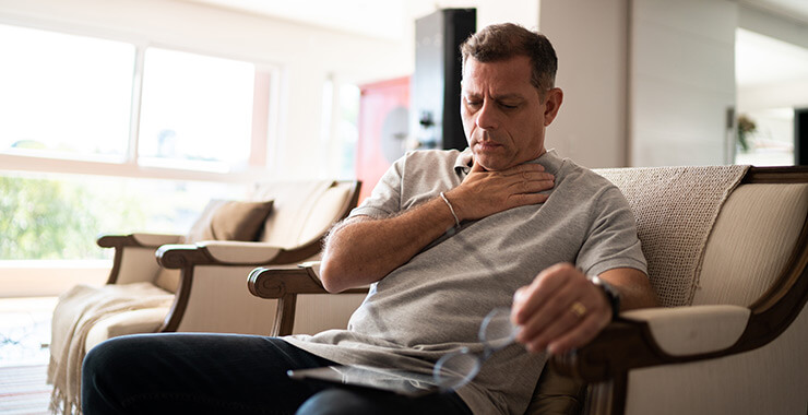 Man experiencing GERD symptoms