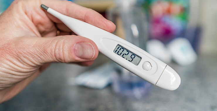 Thermometer with a temperature reading of 102.9