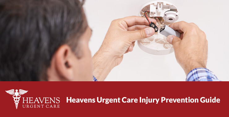 Man changing smoke alarm batteries