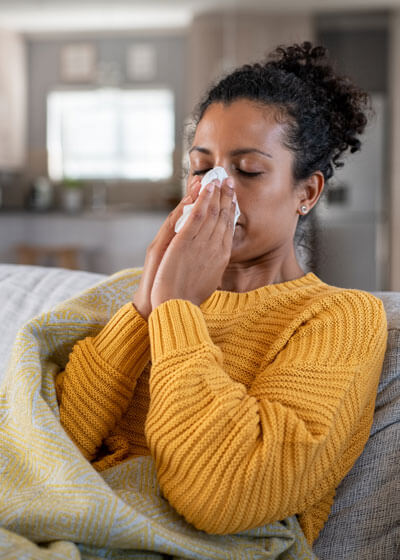 Woman with cold symptoms