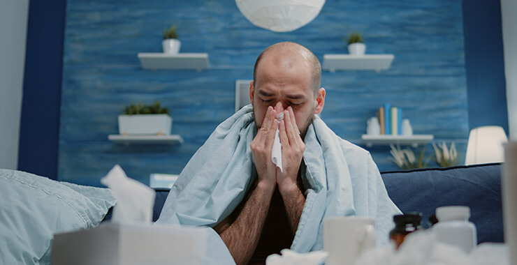 Man blowing his nose