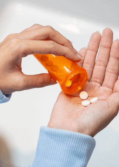 Prescription pills poured into hand